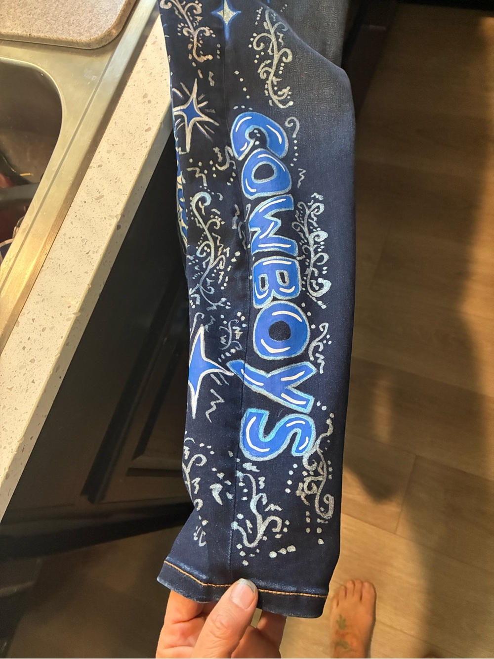 Navy Blue Cropped Women's Jeans with Hand-Painted Cowboys Graphic. Hand painted